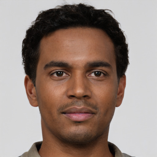 Neutral black young-adult male with short  brown hair and brown eyes