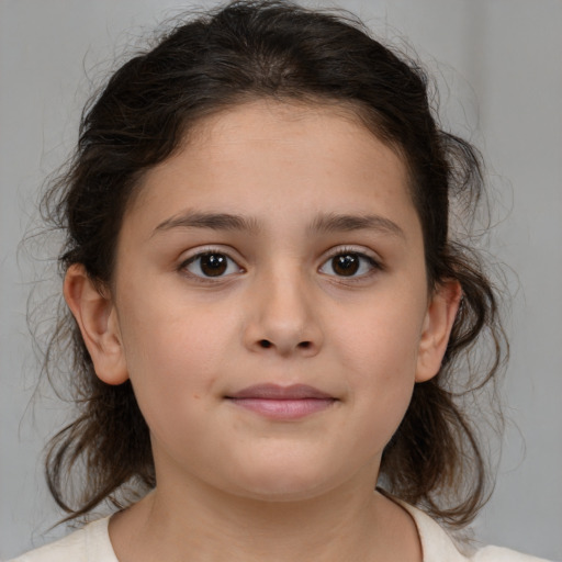 Joyful white child female with medium  brown hair and brown eyes