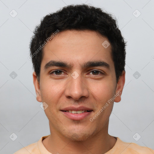 Joyful white young-adult male with short  black hair and brown eyes