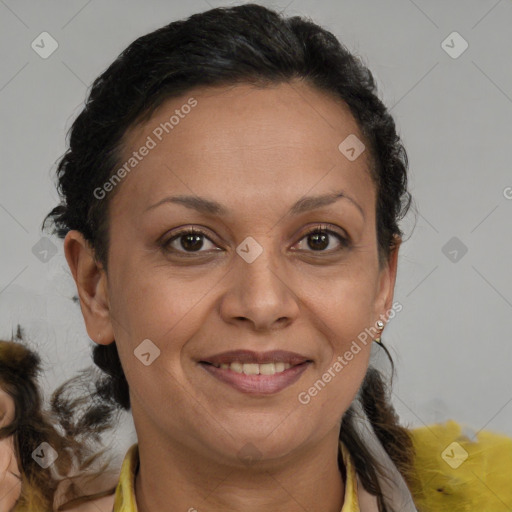 Joyful black adult female with medium  brown hair and brown eyes