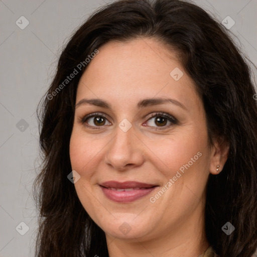 Joyful white adult female with long  brown hair and brown eyes