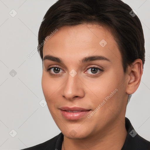 Joyful white young-adult female with short  brown hair and brown eyes