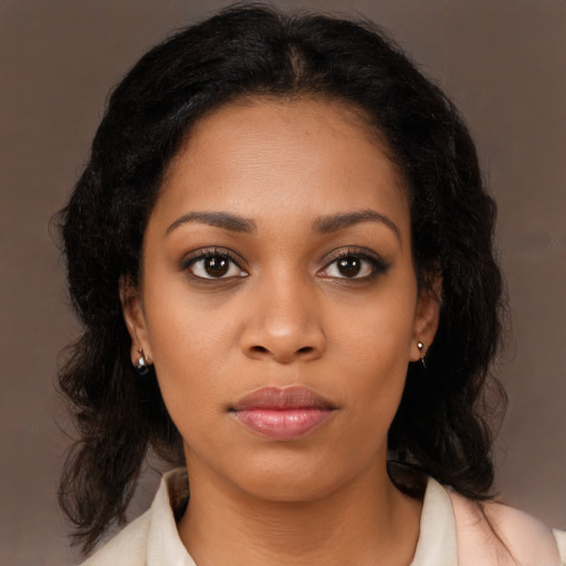Neutral black young-adult female with medium  brown hair and brown eyes