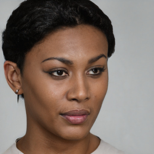 Neutral black young-adult female with short  brown hair and brown eyes
