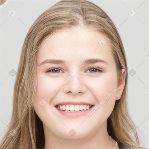 Joyful white young-adult female with long  brown hair and blue eyes