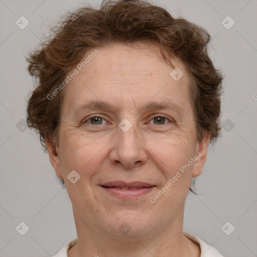 Joyful white adult female with short  brown hair and brown eyes