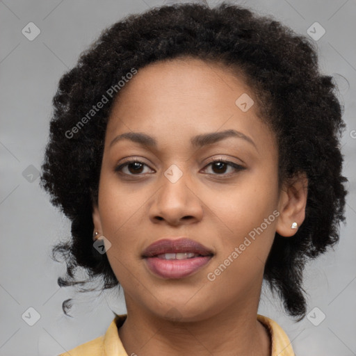 Joyful black young-adult female with long  brown hair and brown eyes