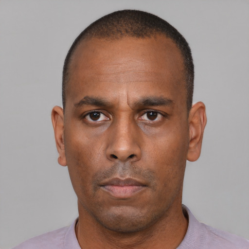 Neutral black adult male with short  black hair and brown eyes