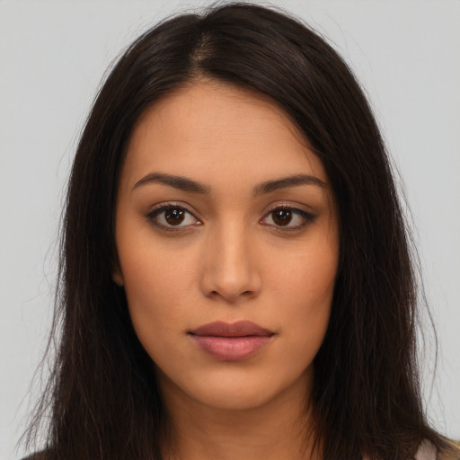Neutral latino young-adult female with long  brown hair and brown eyes