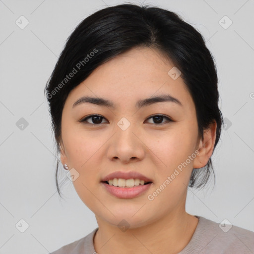 Joyful asian young-adult female with medium  black hair and brown eyes