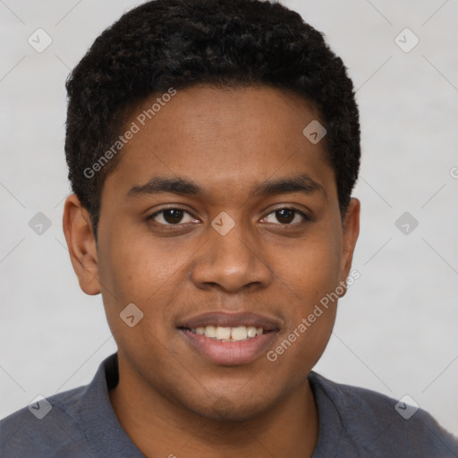 Joyful black young-adult male with short  brown hair and brown eyes