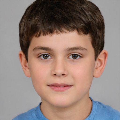 Joyful white child male with short  brown hair and brown eyes