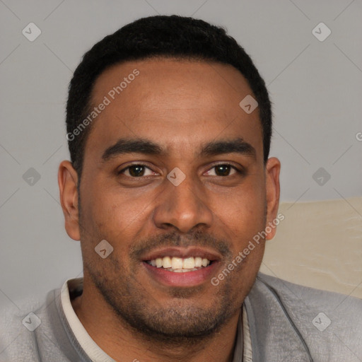 Joyful black young-adult male with short  brown hair and brown eyes