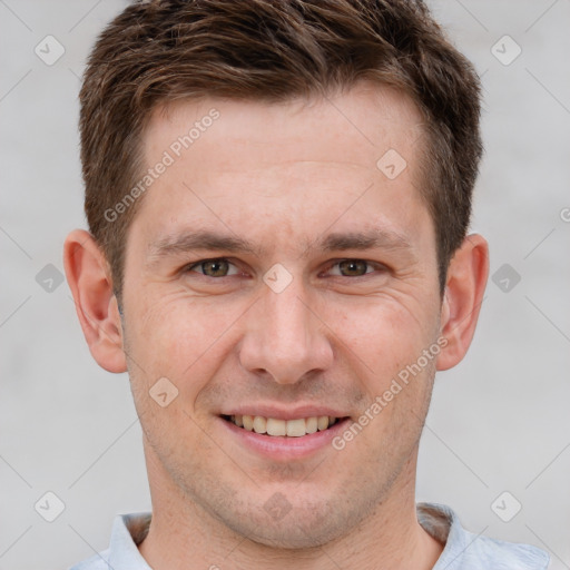 Joyful white adult male with short  brown hair and grey eyes