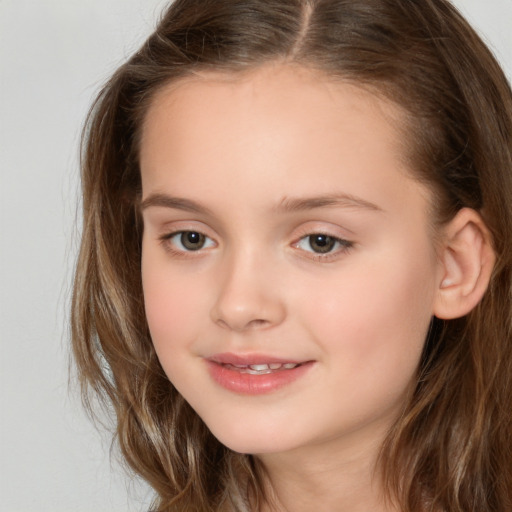 Joyful white child female with long  brown hair and brown eyes