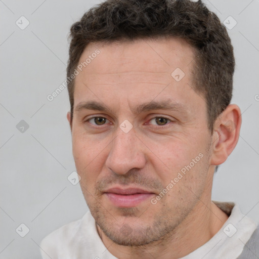 Joyful white adult male with short  brown hair and brown eyes