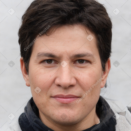 Joyful white adult male with short  brown hair and grey eyes