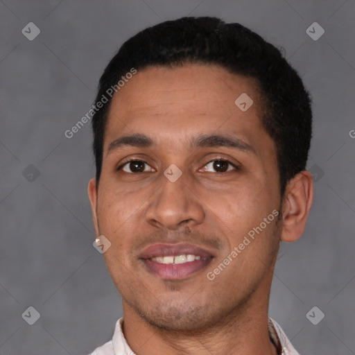 Joyful latino young-adult male with short  black hair and brown eyes