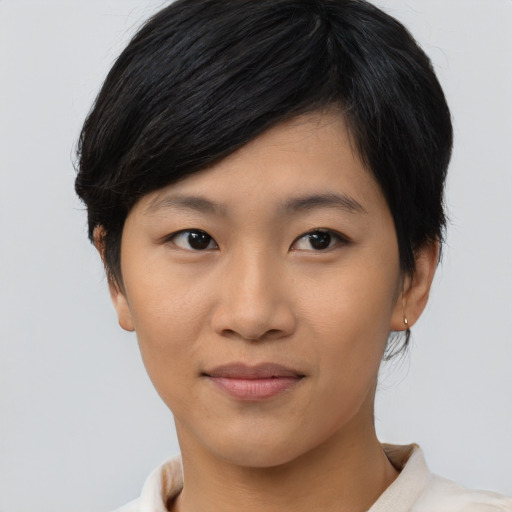 Joyful asian young-adult female with short  black hair and brown eyes