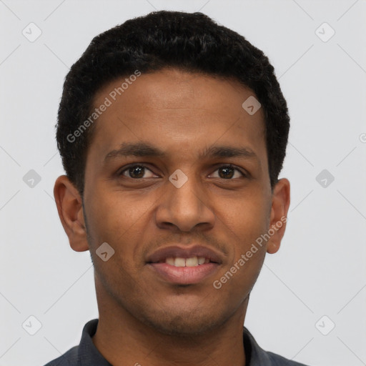 Joyful black young-adult male with short  black hair and brown eyes