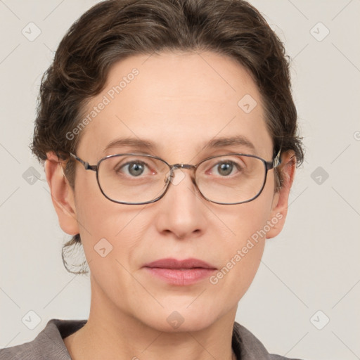 Joyful white adult female with short  brown hair and grey eyes