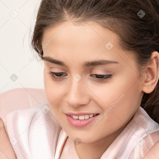 Joyful white child female with medium  brown hair and brown eyes