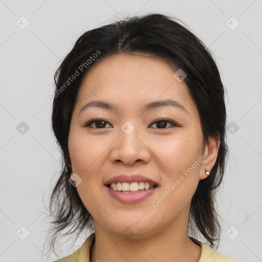 Joyful asian young-adult female with medium  brown hair and brown eyes