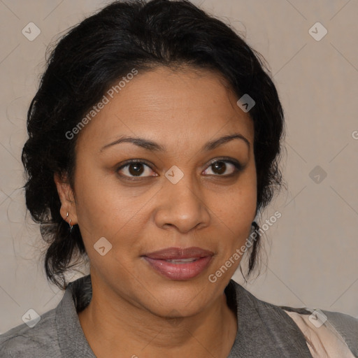 Joyful latino adult female with medium  brown hair and brown eyes