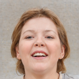 Joyful white young-adult female with medium  brown hair and blue eyes