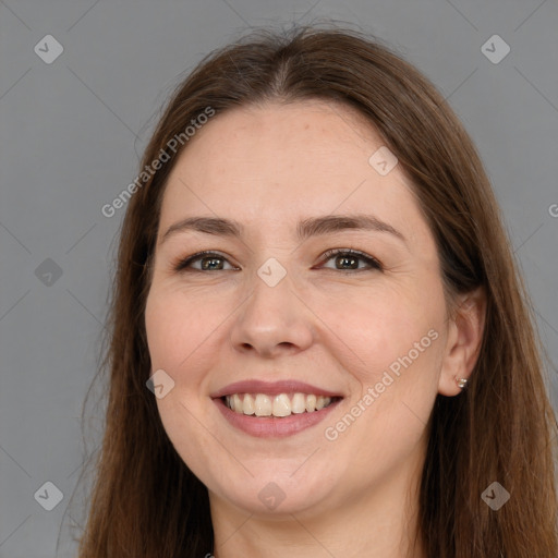 Joyful white adult female with long  brown hair and brown eyes