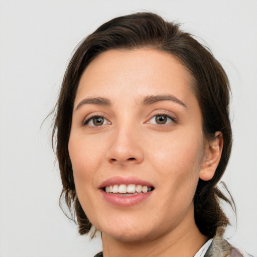 Joyful white young-adult female with medium  brown hair and brown eyes