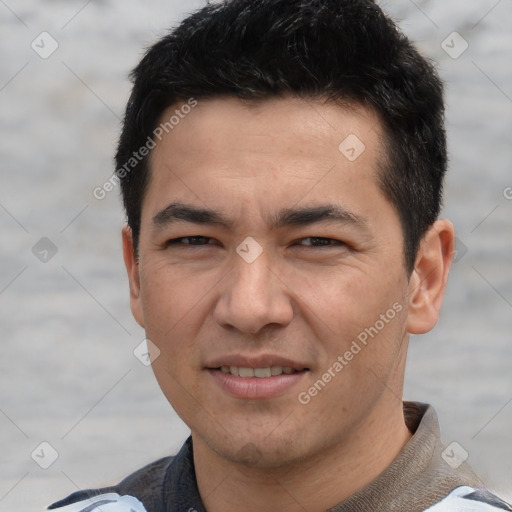 Joyful white young-adult male with short  black hair and brown eyes