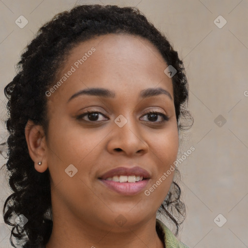 Joyful black young-adult female with long  brown hair and brown eyes