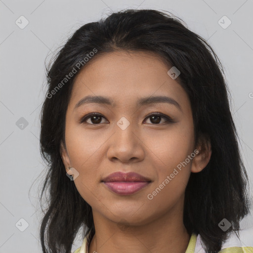 Joyful latino young-adult female with medium  brown hair and brown eyes