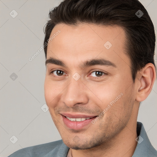 Joyful white young-adult male with short  brown hair and brown eyes