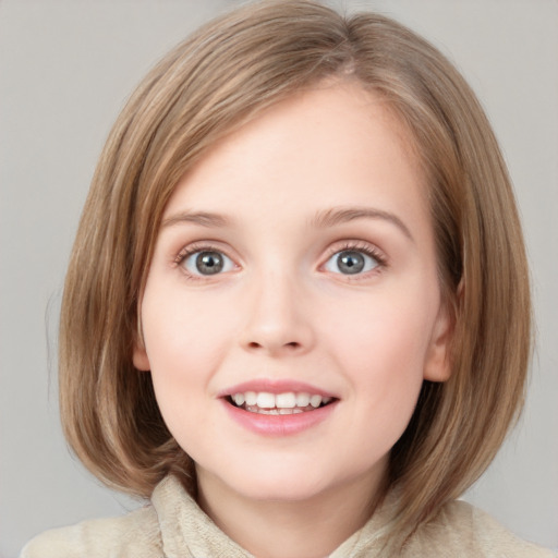 Joyful white child female with medium  brown hair and blue eyes