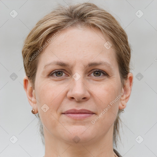 Joyful white adult female with medium  brown hair and grey eyes