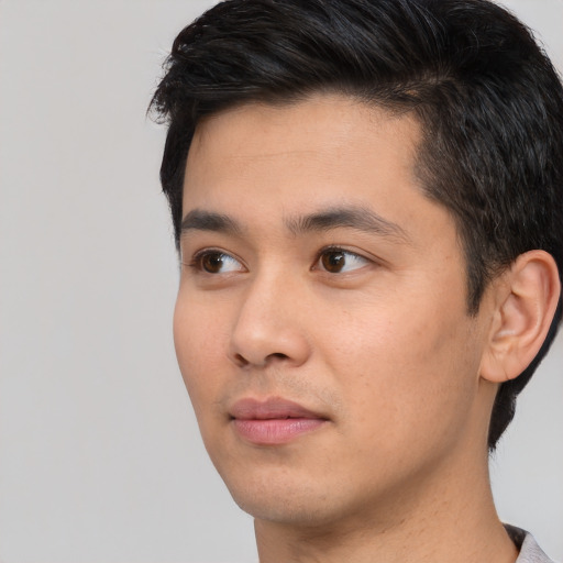 Neutral white young-adult male with short  black hair and brown eyes