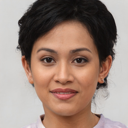 Joyful asian young-adult female with medium  black hair and brown eyes