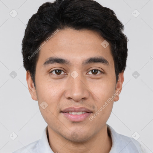 Joyful white young-adult male with short  black hair and brown eyes