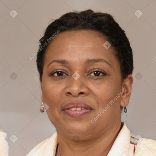 Joyful latino adult female with short  brown hair and brown eyes