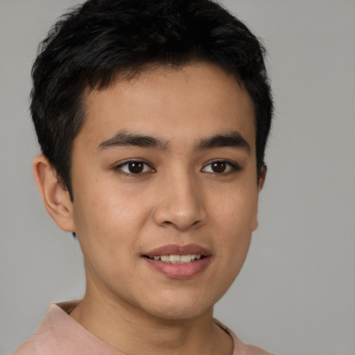 Joyful asian young-adult male with short  brown hair and brown eyes