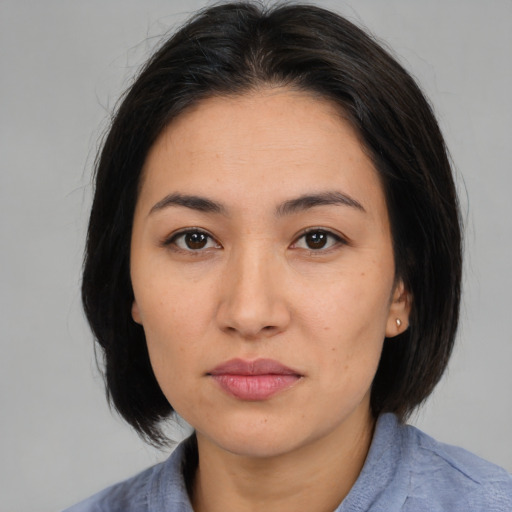 Neutral asian young-adult female with medium  brown hair and brown eyes