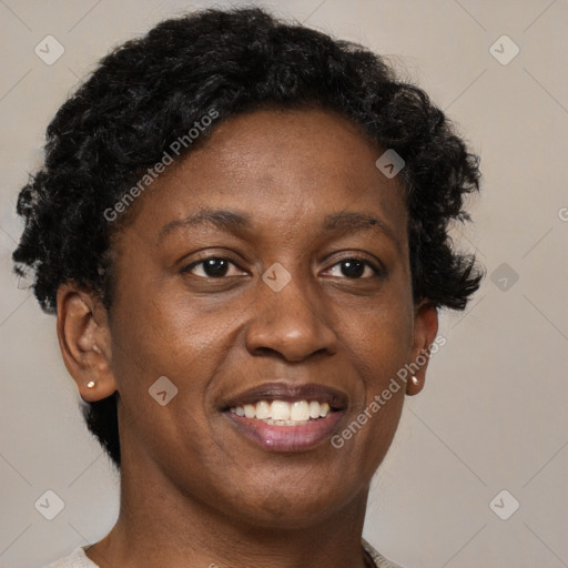 Joyful black adult female with short  brown hair and brown eyes