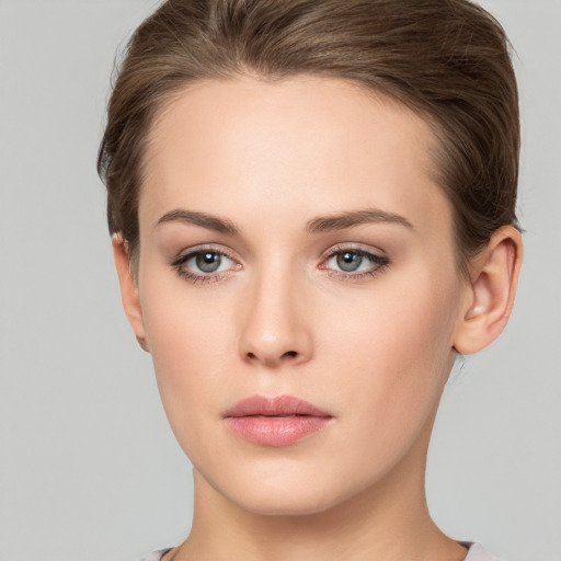 Neutral white young-adult female with short  brown hair and brown eyes