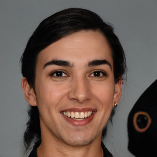 Joyful white young-adult female with medium  black hair and brown eyes