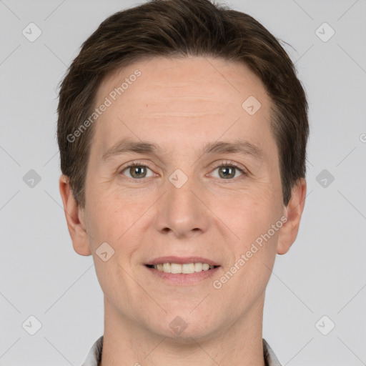 Joyful white adult male with short  brown hair and grey eyes