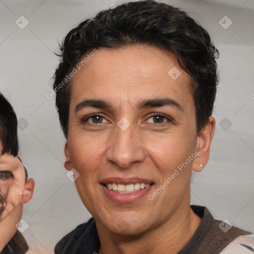 Joyful white adult male with short  brown hair and brown eyes