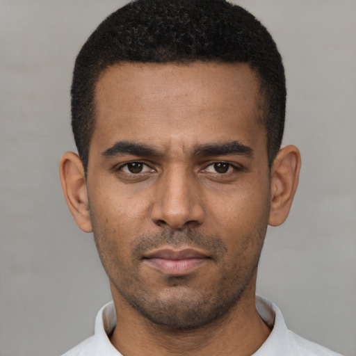 Neutral latino young-adult male with short  black hair and brown eyes