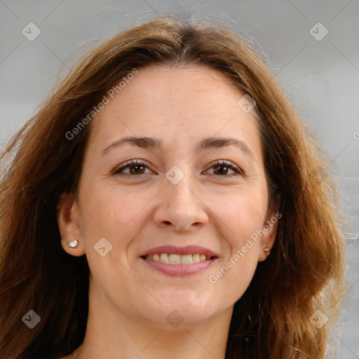 Joyful white adult female with long  brown hair and brown eyes